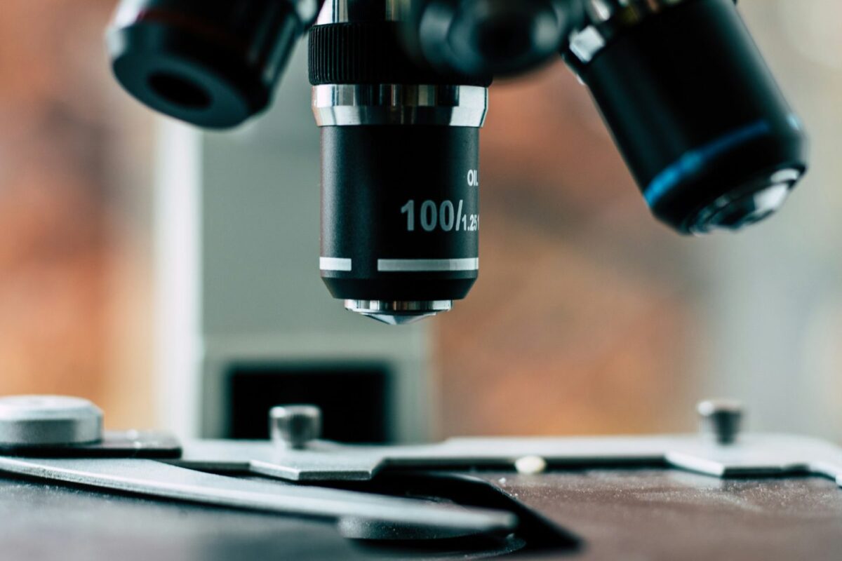 Close-up of microscope objective lenses above the slide stage